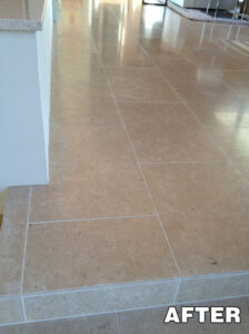 High-gloss tile floor reflecting vanity lights—tile polishing services in Tucson.
